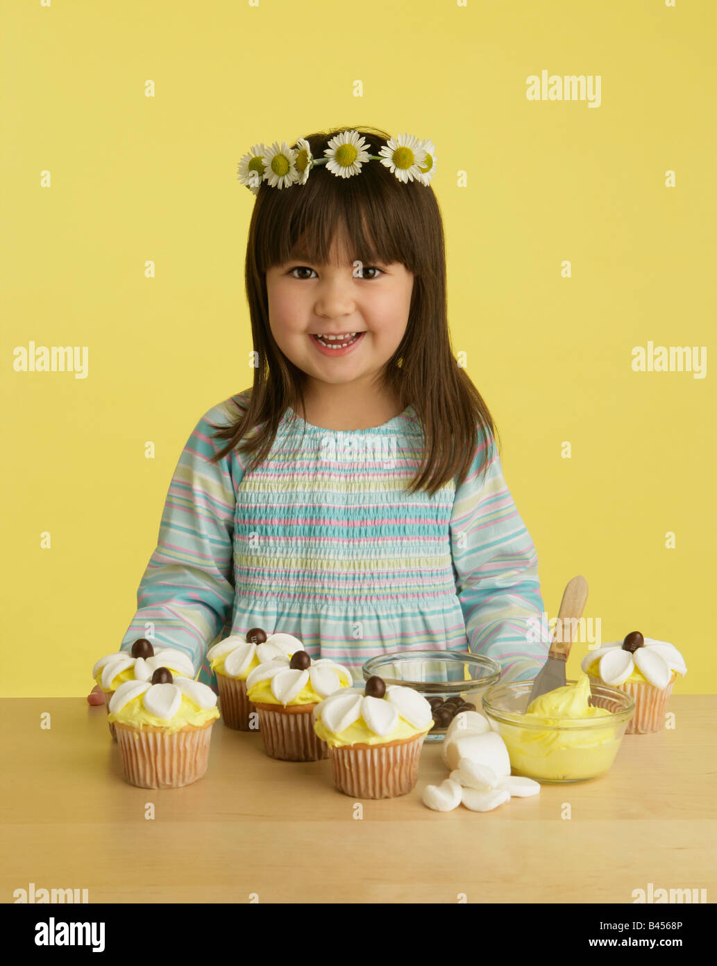 Little girl with decorated cupcakes Stock Photo Alamy