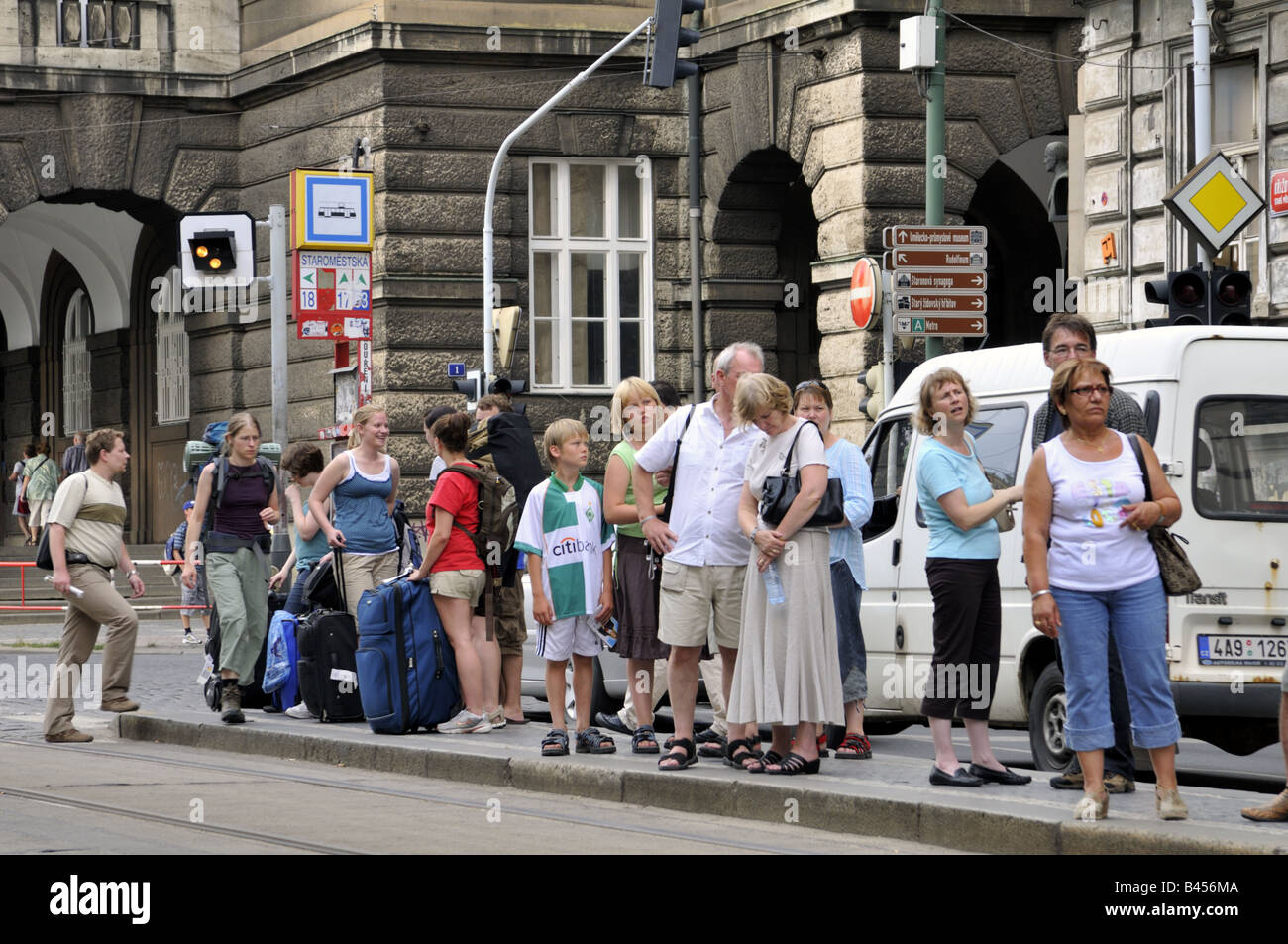 Queue of people waiting at the Starmestska tram stop Prague, Czech Republic. Stock Photo