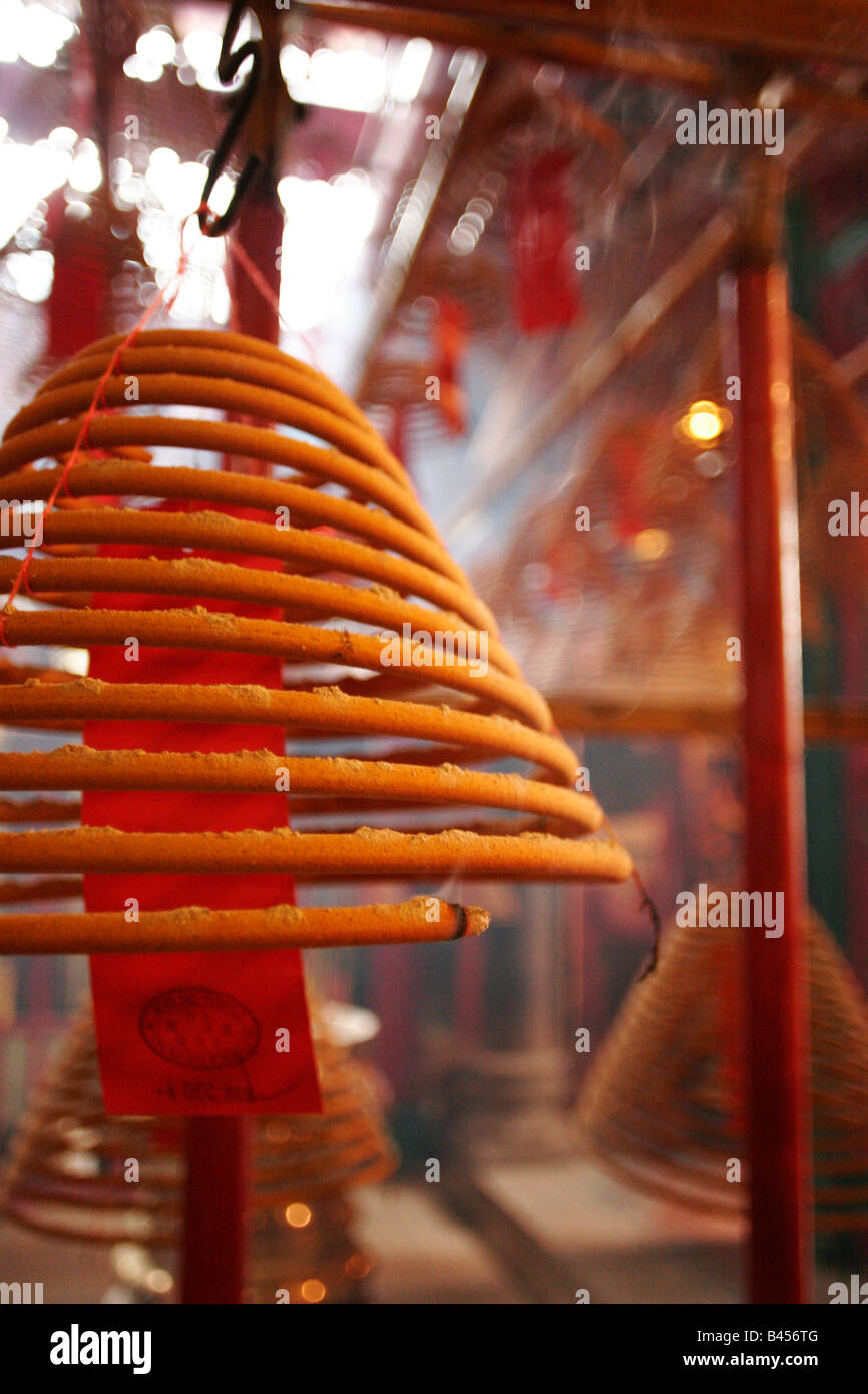 China, Hong Kong, Man Mo Temple, Spiral coil of incense, slip of paper with prayer Stock Photo