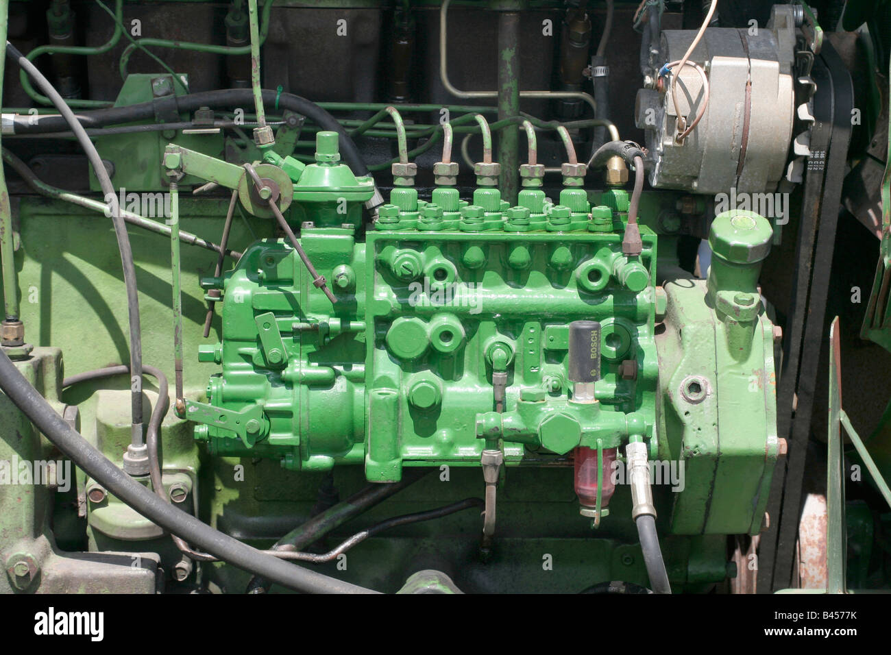 Diesel fuel injection system and alternator on a farm tractor Stock