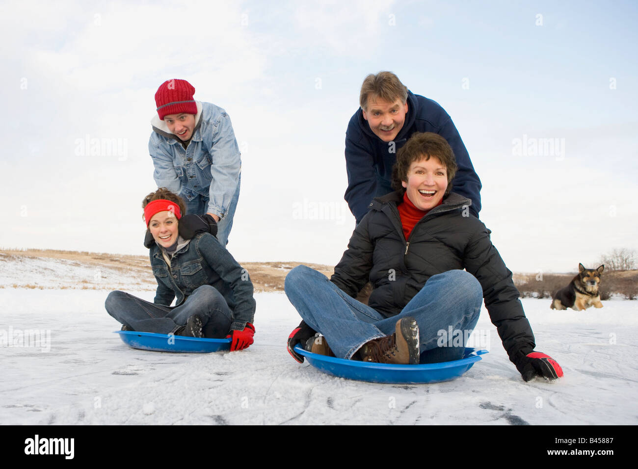 Family enjoying the winter Stock Photo - Alamy