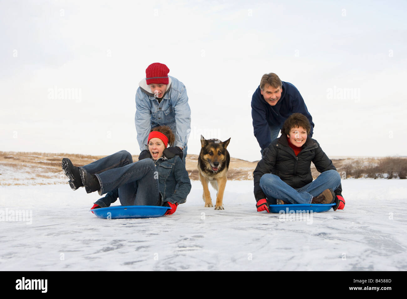Family enjoying the winter Stock Photo - Alamy