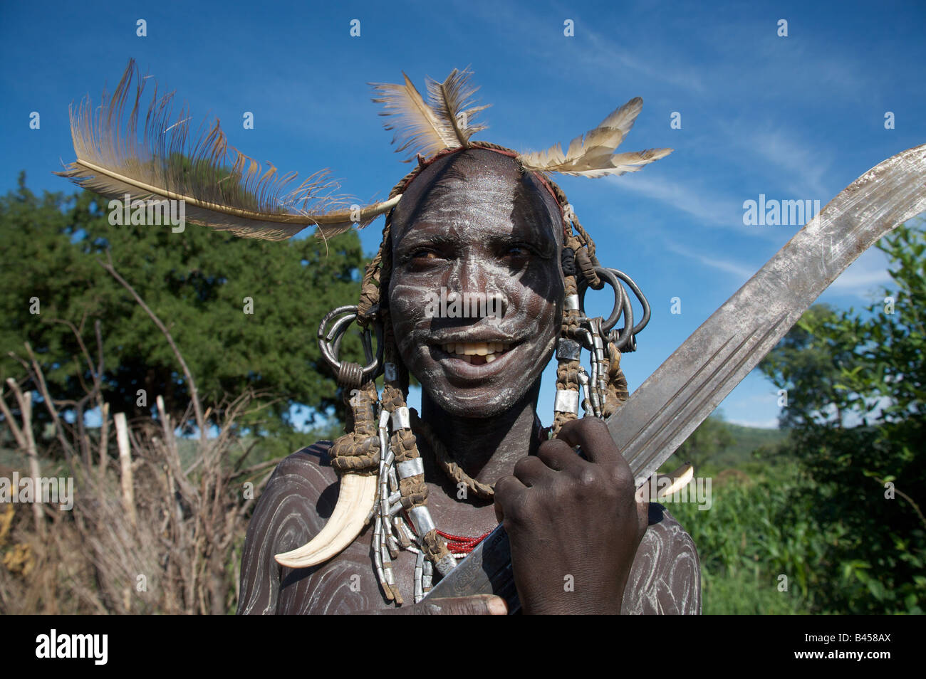 A man from the Mursi tribe holds a machete, Mago National Park
