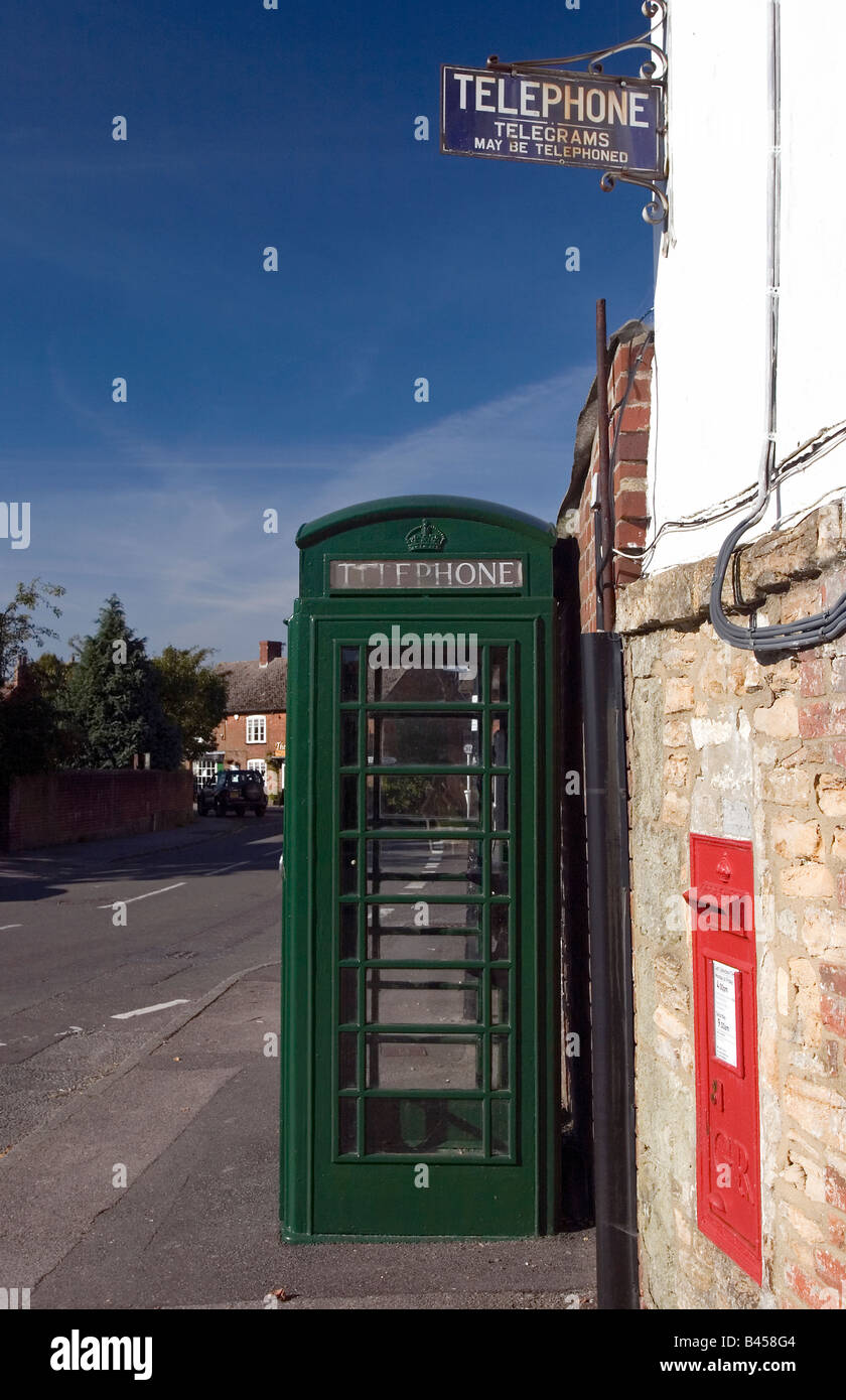 Green telephone box in the Dorset village of Okeford Fitzpaine Stock Photo