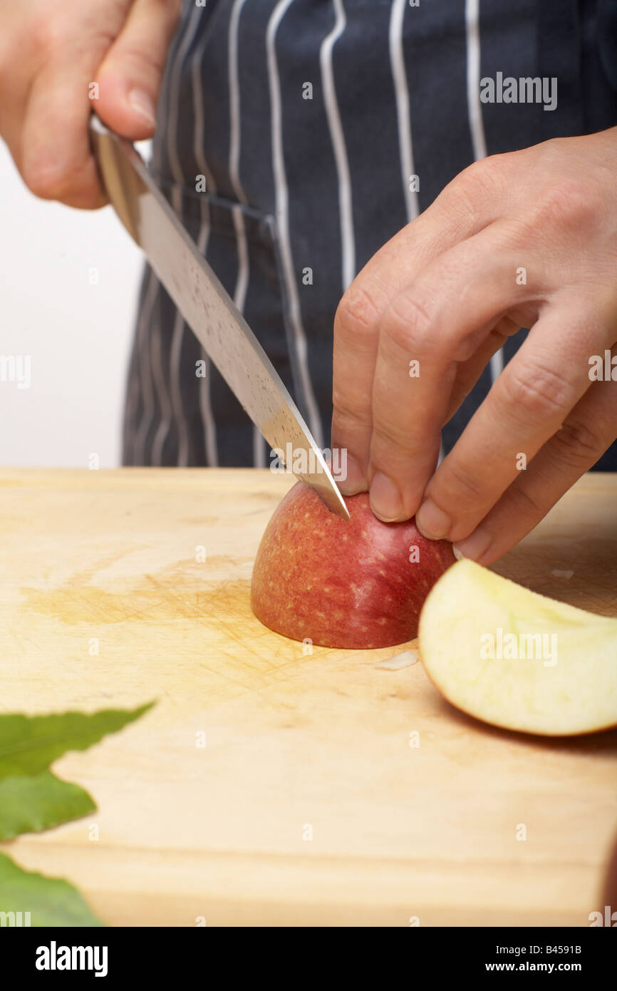 Person cutting an apple, close up Stock Photo - Alamy