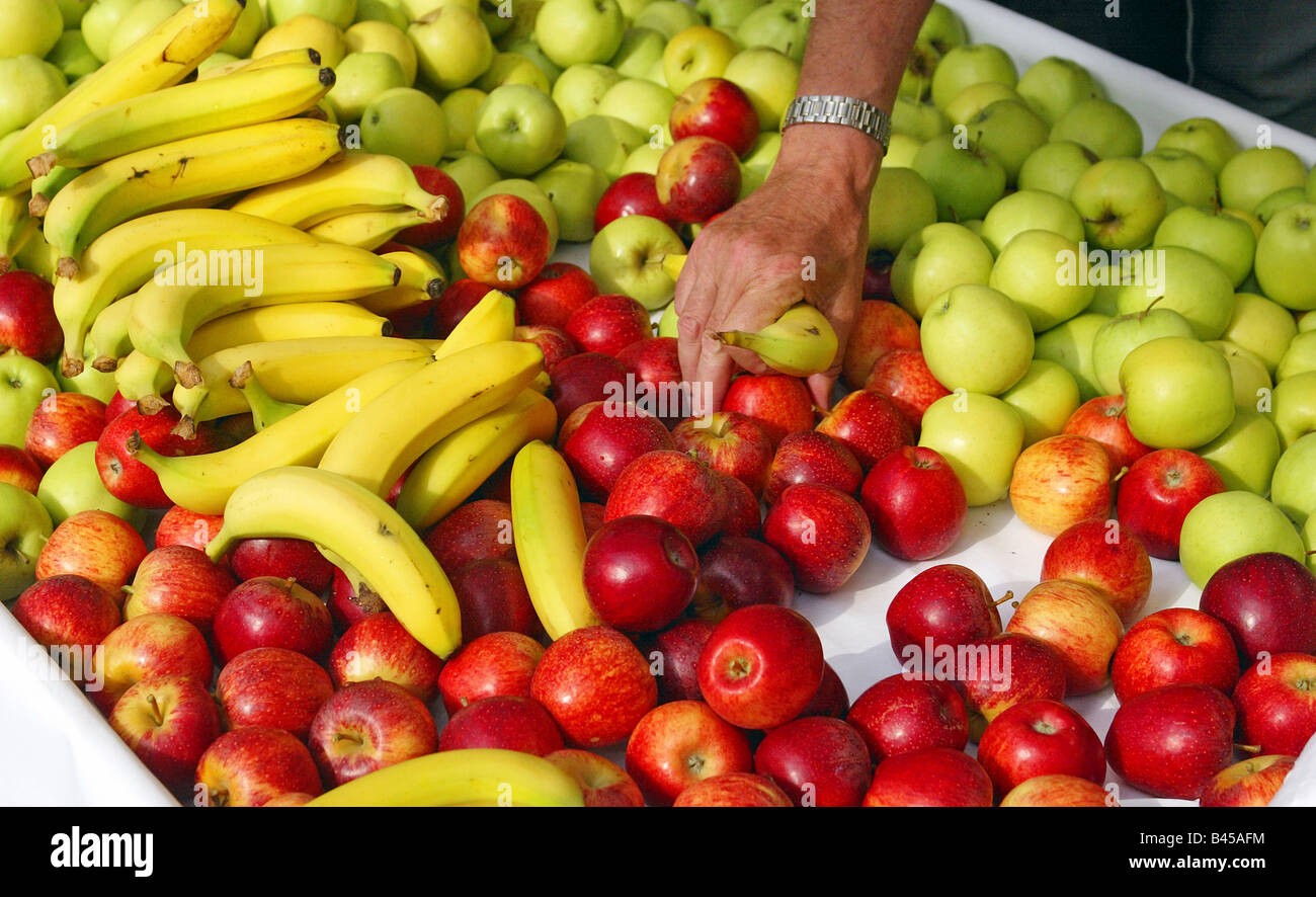 Hand reaching for fruit Stock Photo
