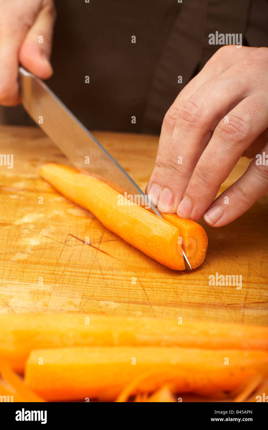 Cutting Carrot In Half Crosswise Close Up Stock Photo Alamy