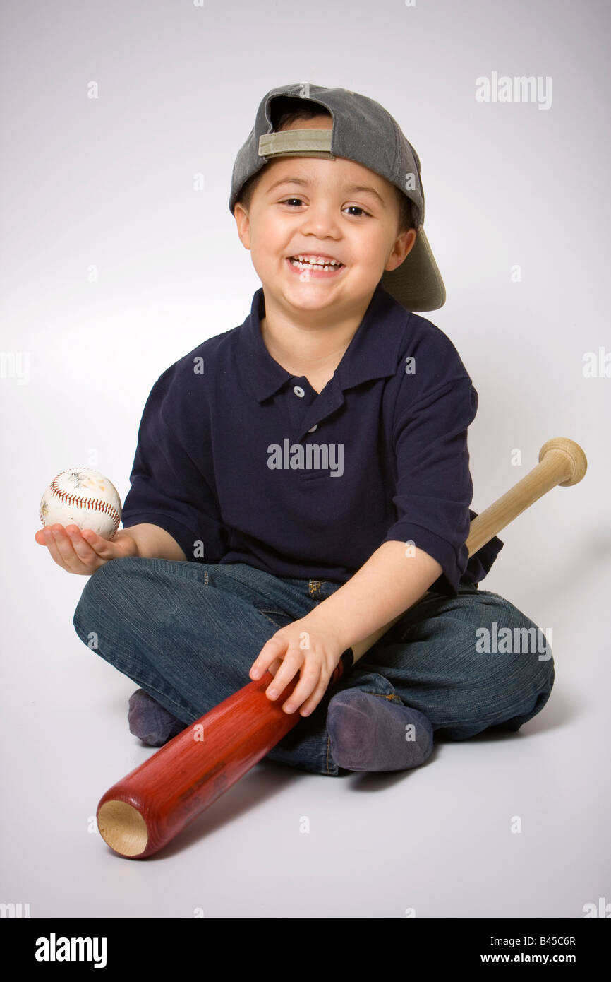 Young hispanic boy with a baseball bat and ball Stock Photo Alamy