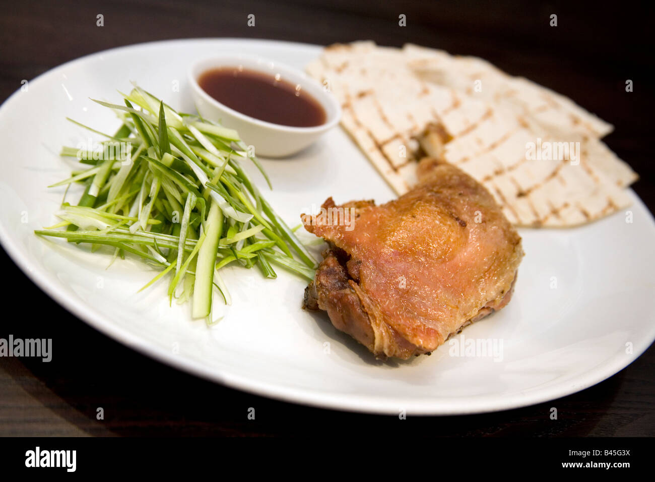 Crispy duck leg Stock Photo - Alamy
