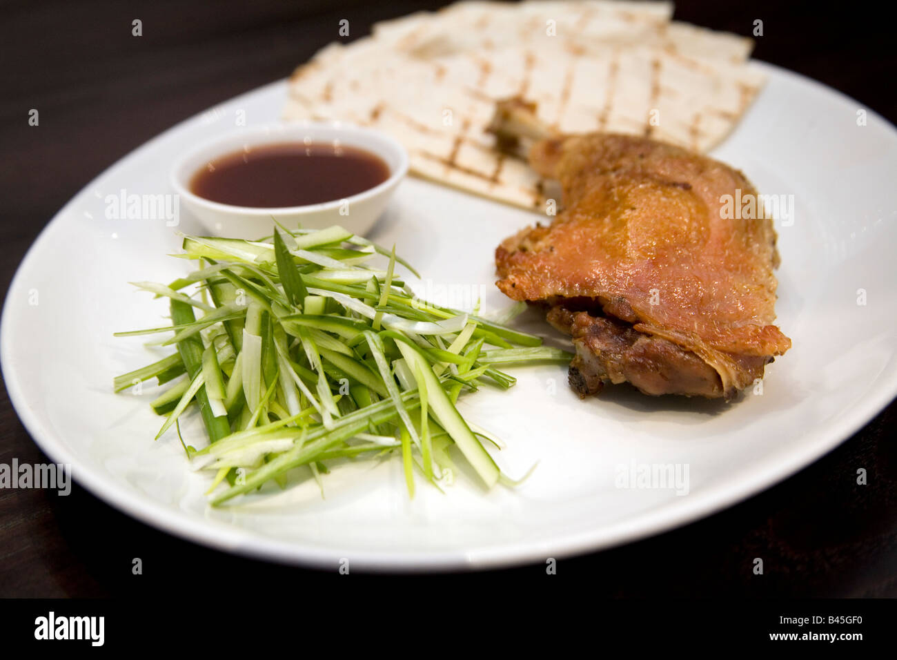 Crispy duck leg Stock Photo - Alamy