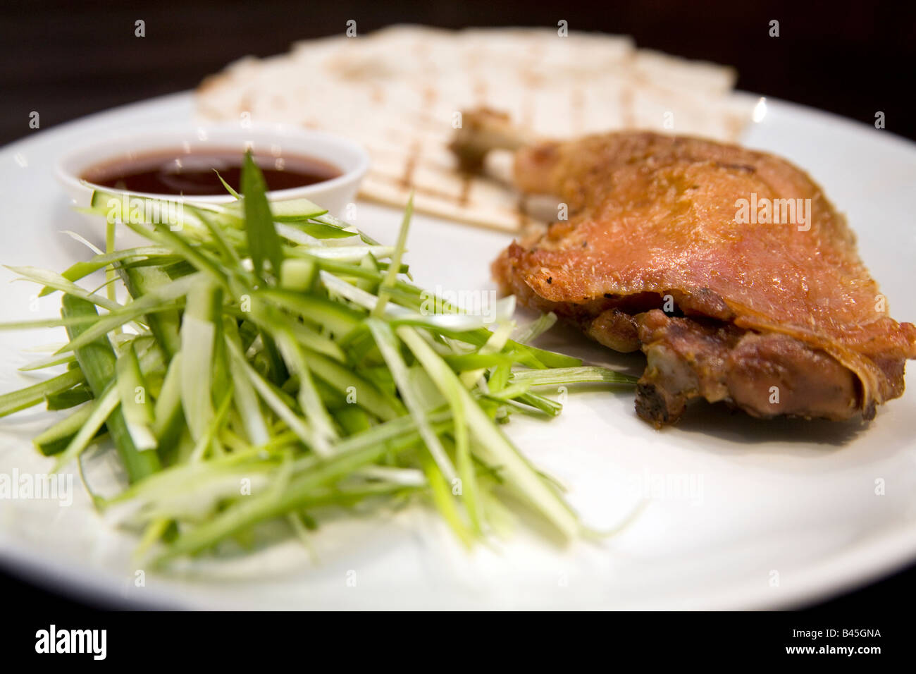 Crispy duck leg Stock Photo - Alamy