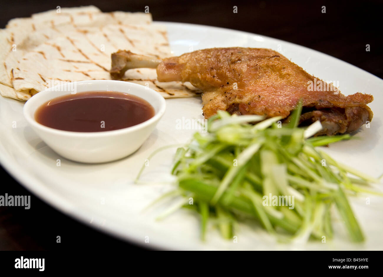 Crispy duck leg Stock Photo - Alamy