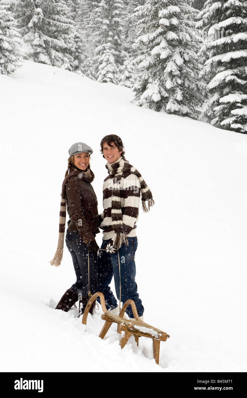 Austria, Salzburger Land, Altenmarkt, Young couple with a sled Stock Photo