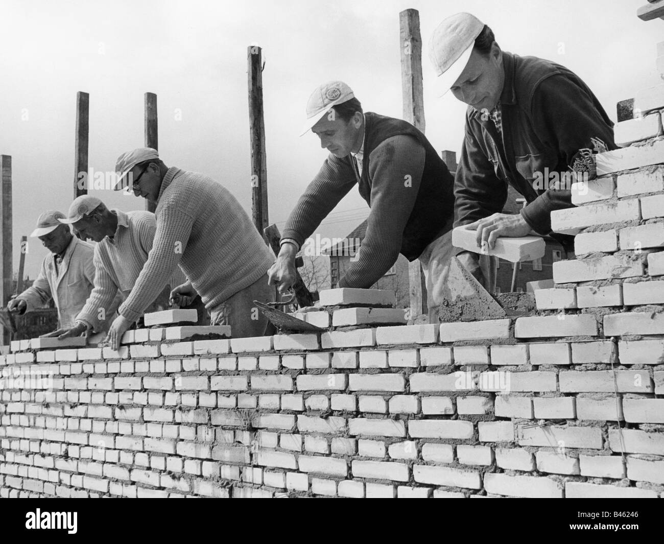 people, professions, bricklayer, five bricklayers during work, 1960
