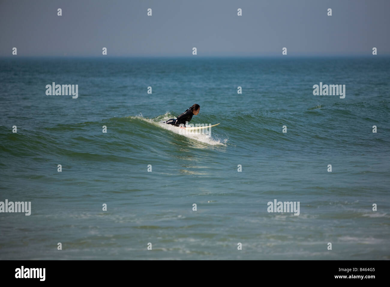 Surfing waves of Far Rockaway Beach on a very hot day of June Far