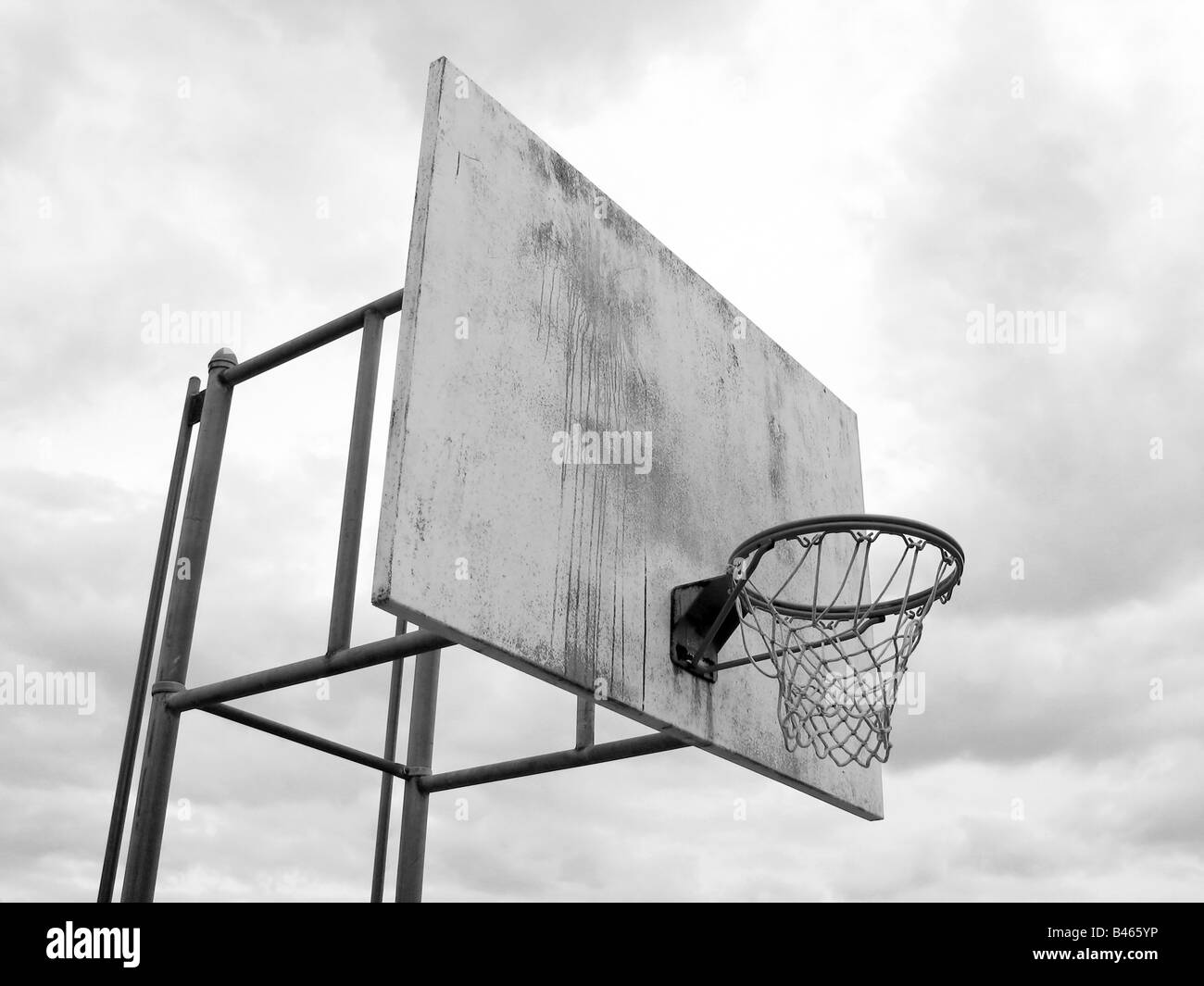 A basketball hoop found at the park in black and white Stock Photo