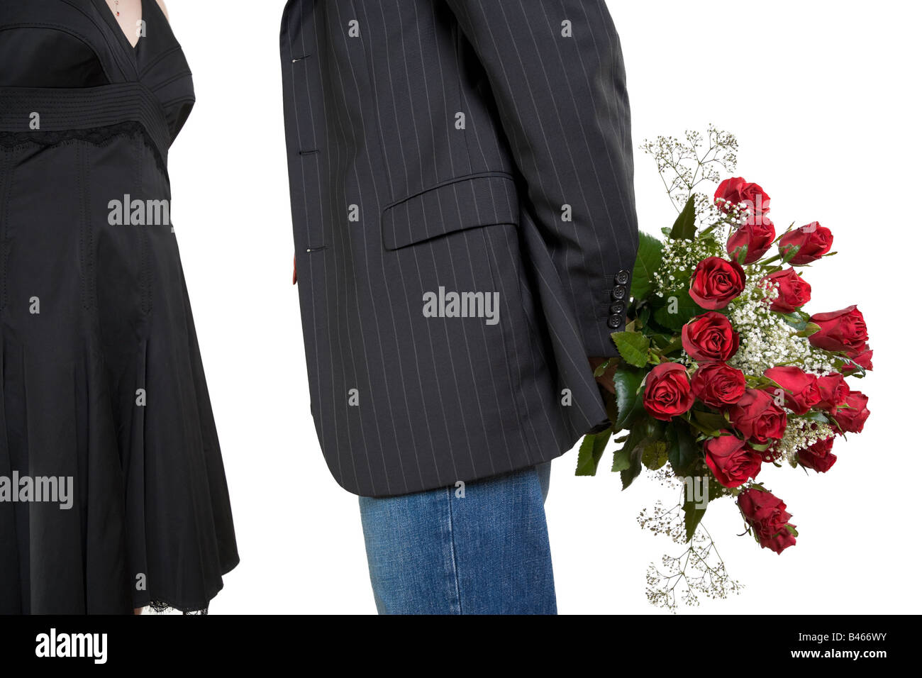 Man holding bouquet of roses behind his back Stock Photo - Alamy