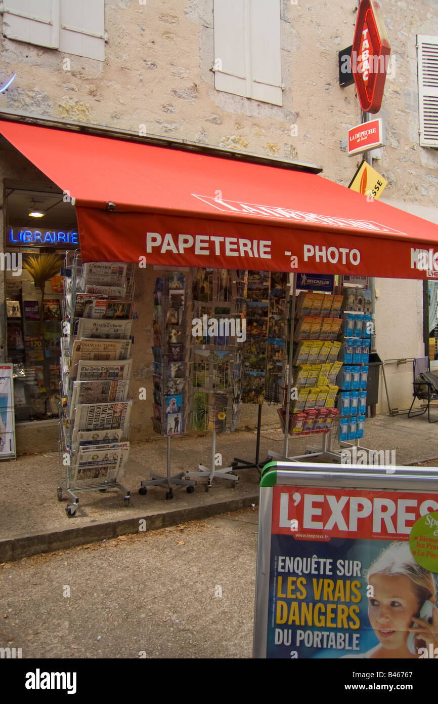 Newsagent tabac with a rack full of english newspapers, Cajarc, 46, Lot, Quercy, France, Europe Stock Photo