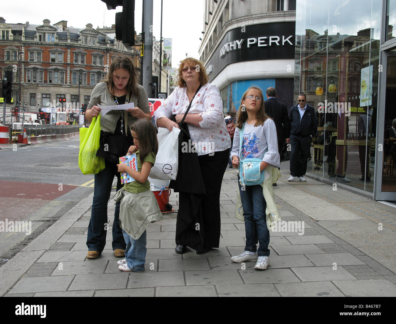 Tourists Shopping in London. New Oxford Street. Stock Photo