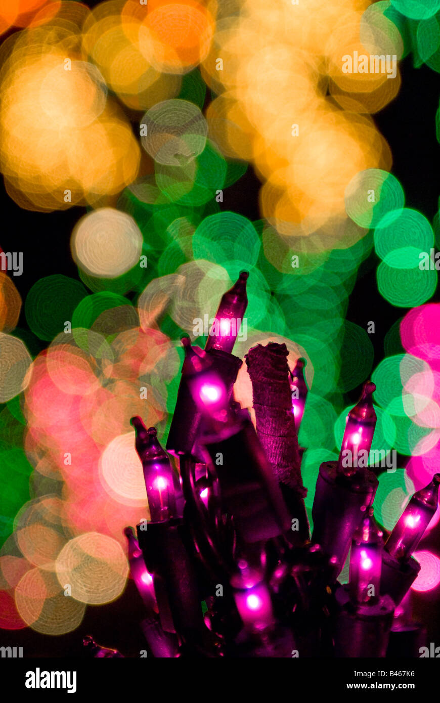 Close up of Christmas lights forming past of a large display in