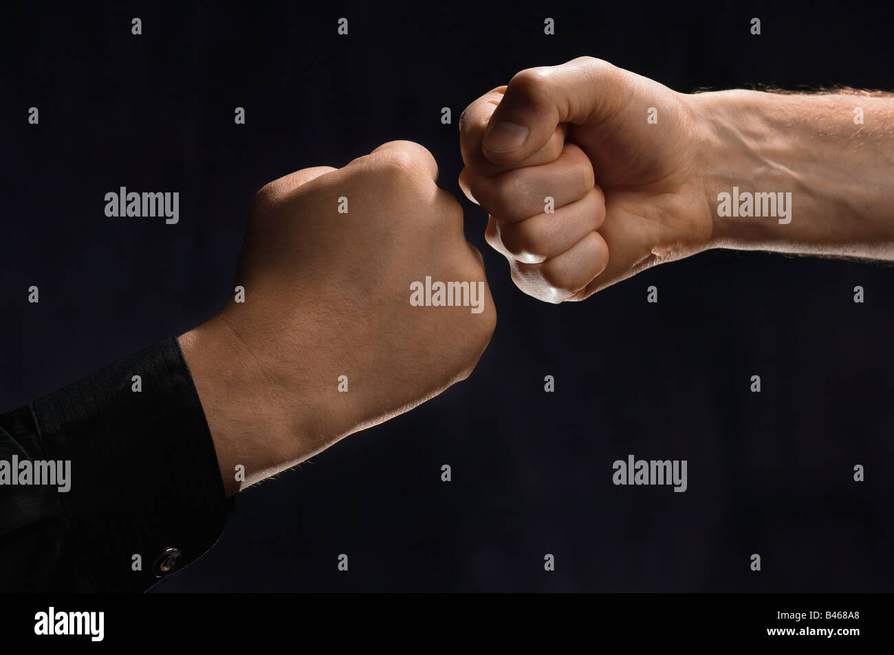 Two men knocking fists together Stock Photo Alamy