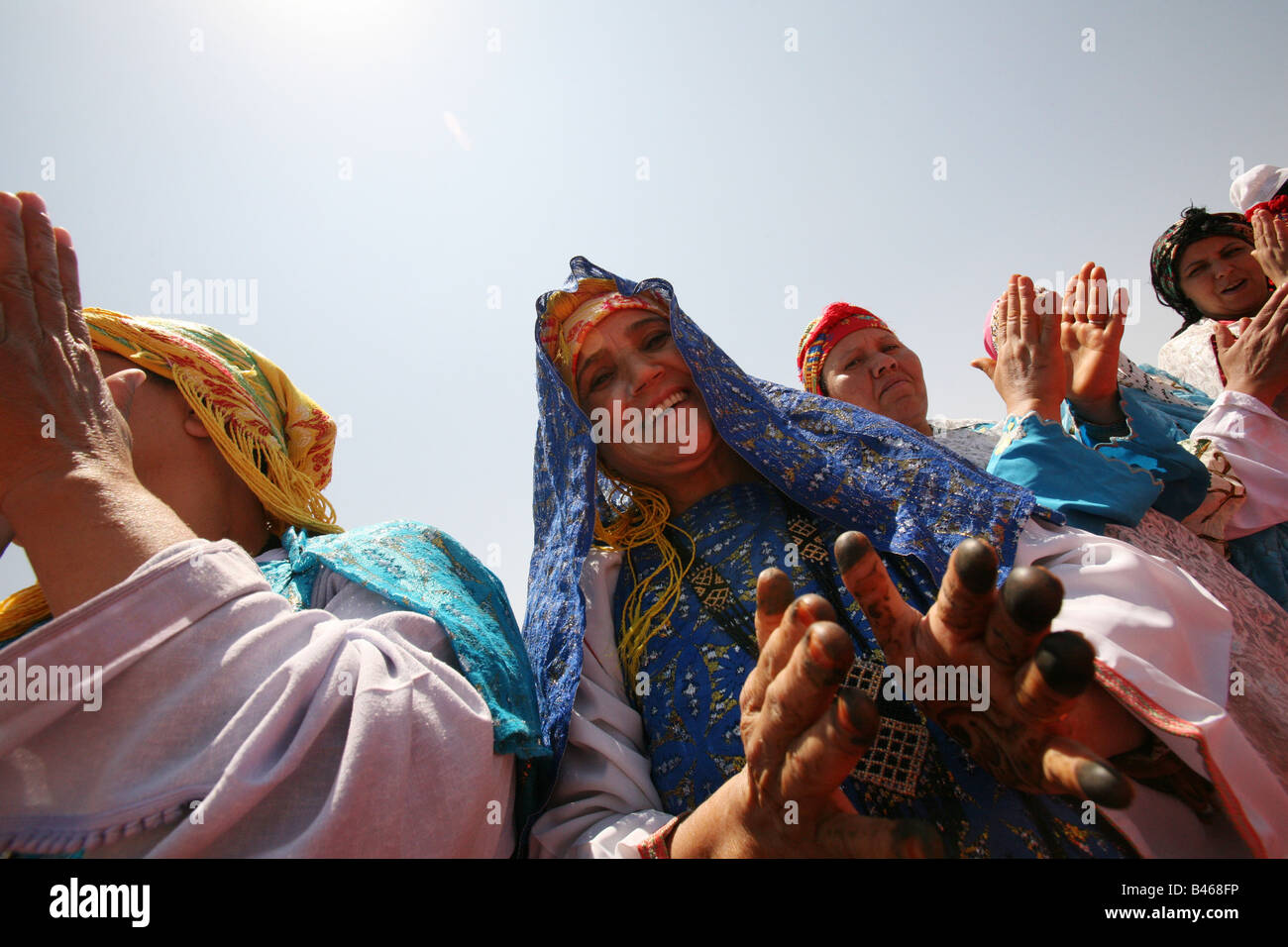 Berber women in traditional dress singing on Kik Plateau, Atlas Mountains, Morocco, North Africa Stock Photo