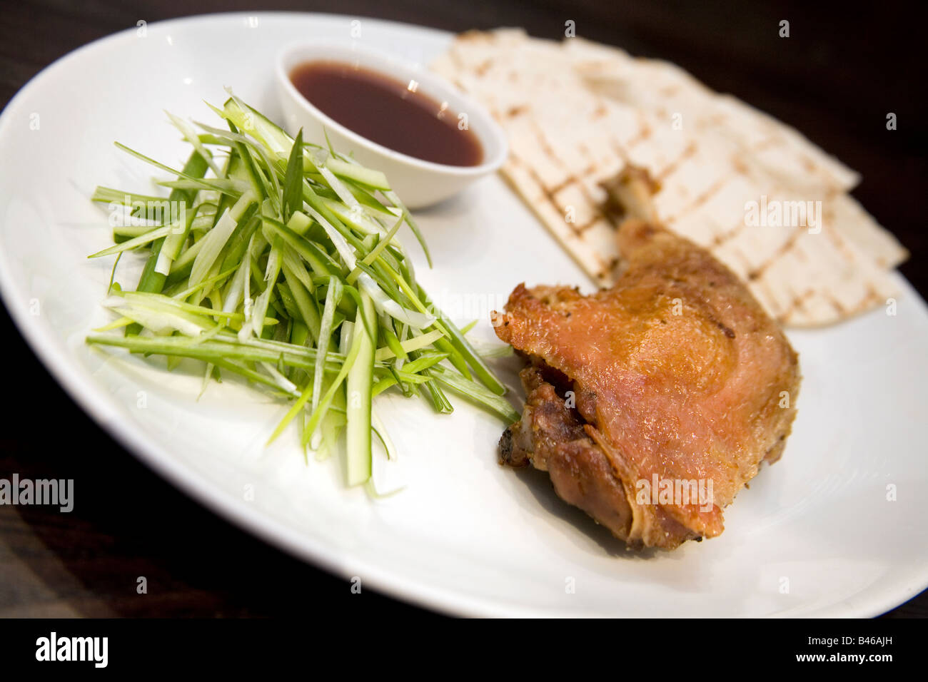 Crispy duck leg Stock Photo - Alamy