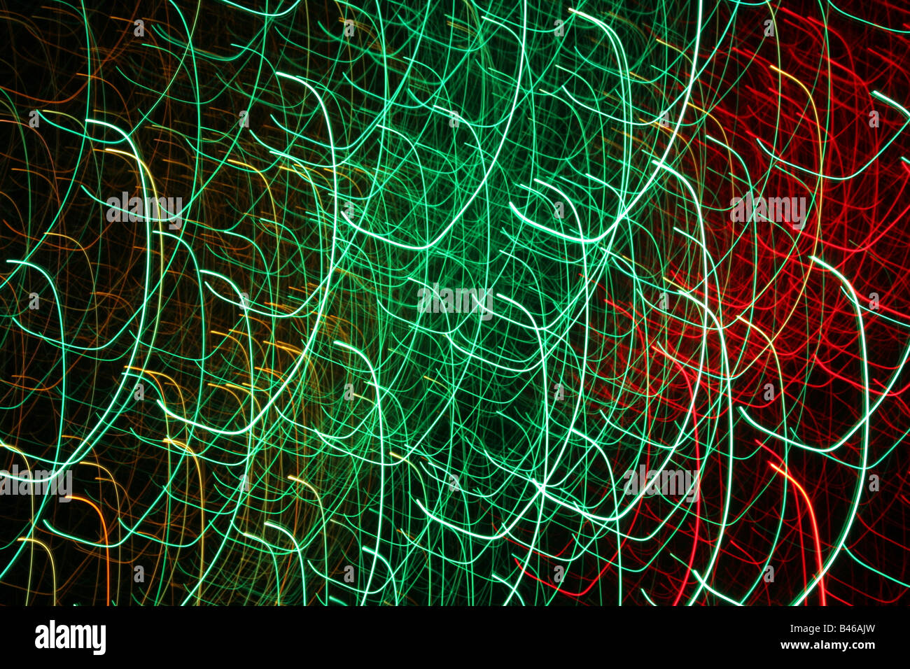 Green and red loops in space on a black background Stock Photo