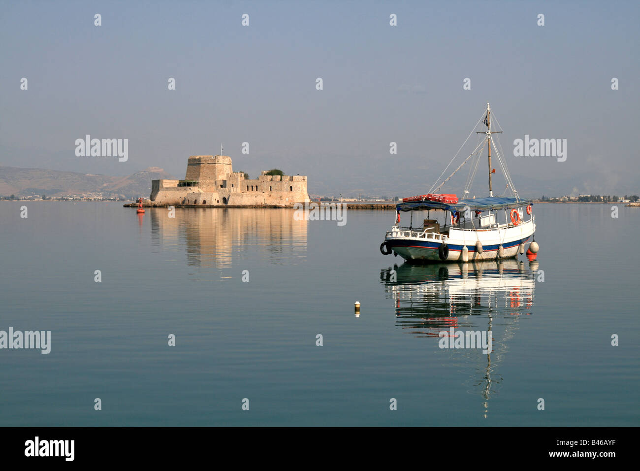Fortress and boat at Nafplion Harbour Stock Photo
