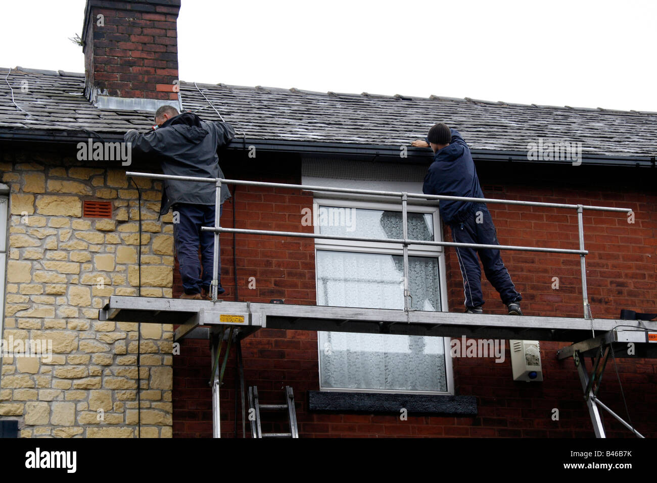 Gutter installation on terraced house