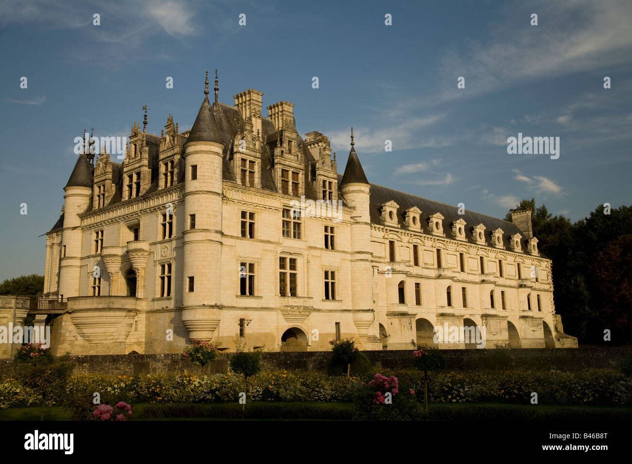 Western face of Chateau de Chenonceau at sunset, Loire Valley, France, seen from Catherine de Medicis's Garden. Stock Photo