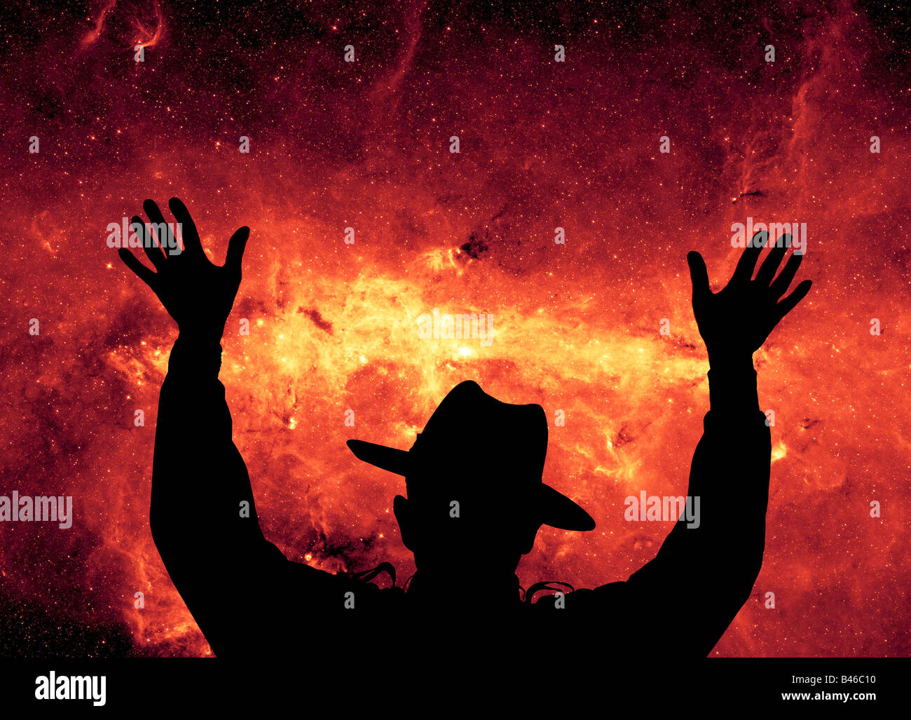 male hippie celebrating life composited on starry galaxy Stock Photo