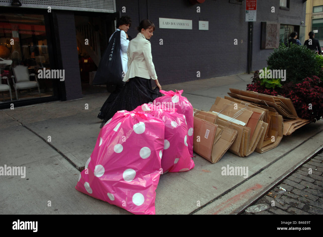 Colorful pink polka dot plastic trash bags are collected in the Meatpacking  district in New York Stock Photo - Alamy