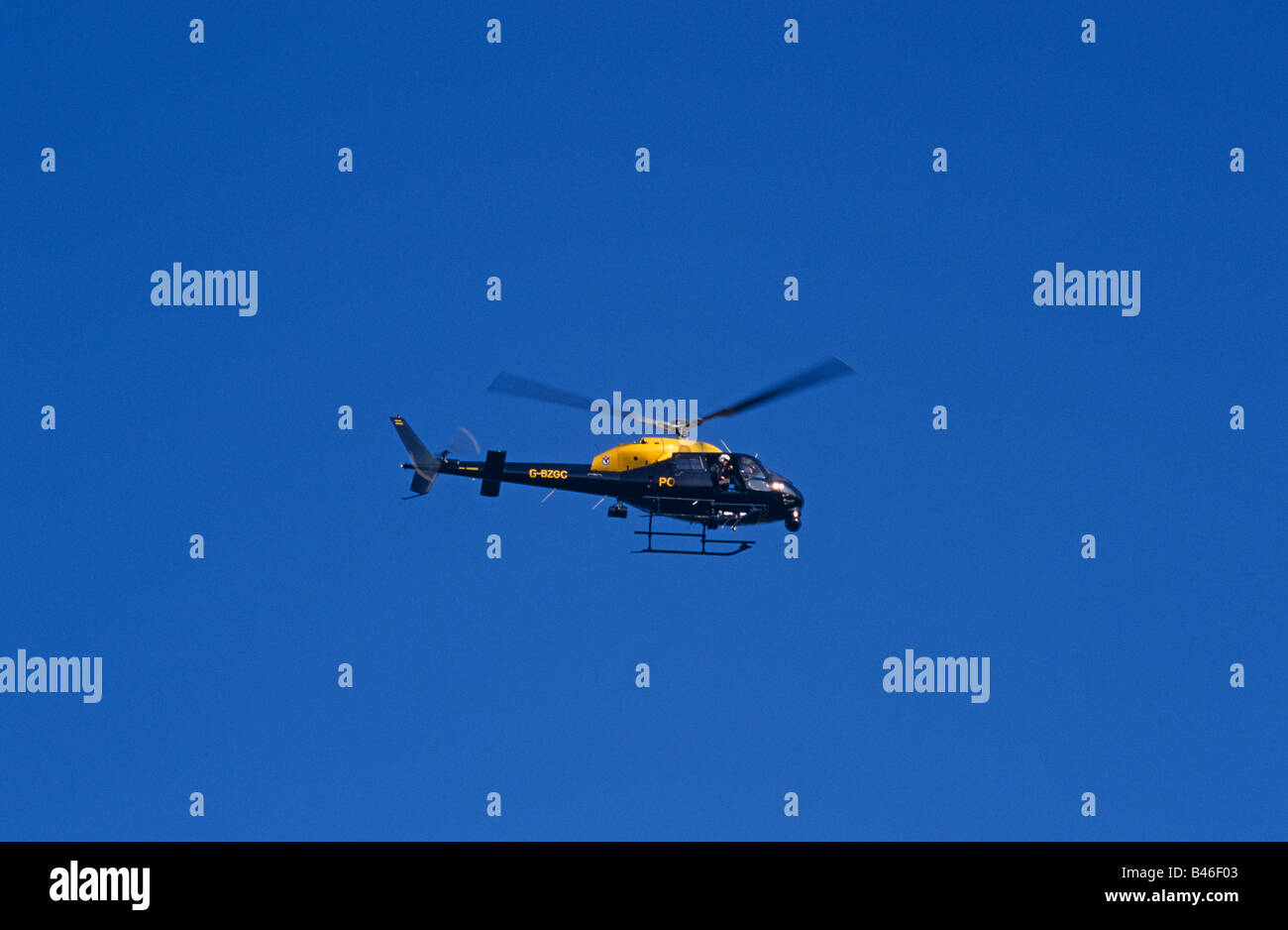 Emergency Service Police Helicopter In Air Yellow Black Police