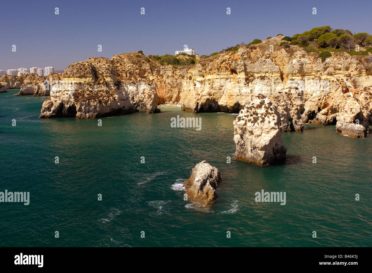 Rock pinnacles and cliffs on the coast line near Praia Da Rocha Portimão in the Algarve Portugal Stock Photo