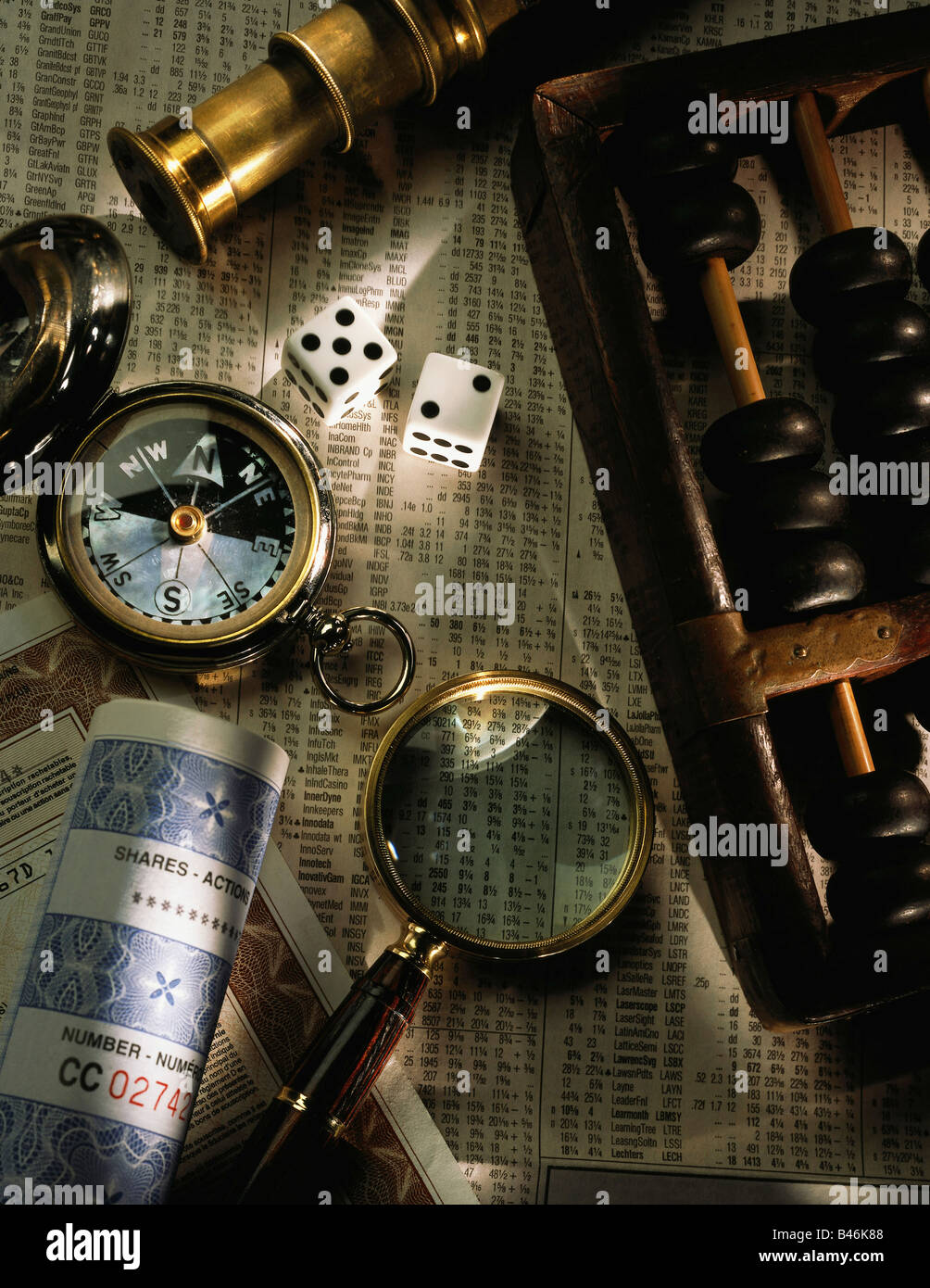 Collage of Abacus, Compass, Dice, Magnifying Glass, Stocks, and Stock Pages Stock Photo