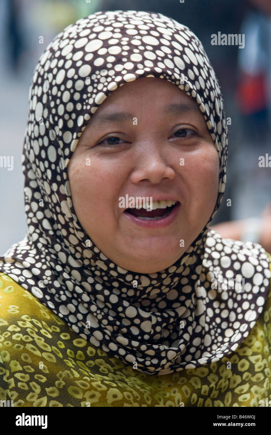 Woman Smiling in the Muslim Quarter in Xian China Stock Photo