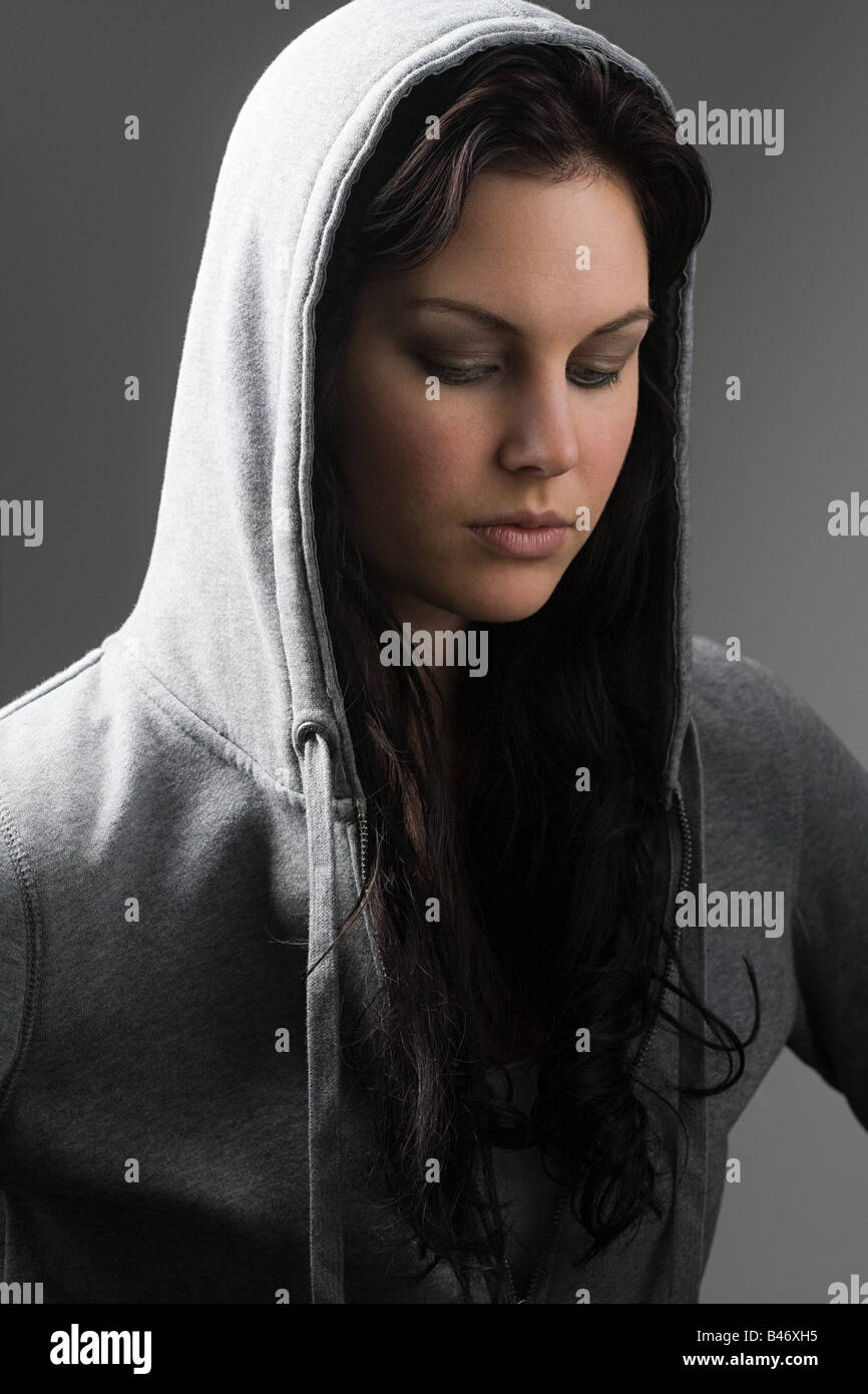 Young woman wearing hooded top Stock Photo