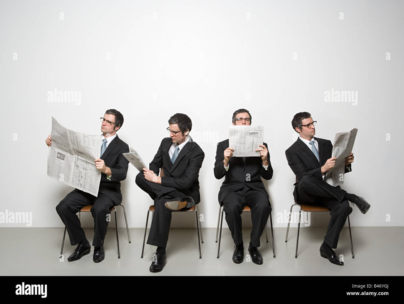 Businessmen reading newspaper Stock Photo