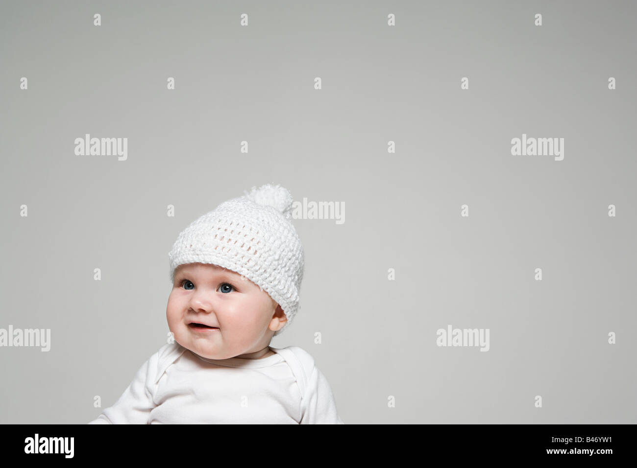 Baby in a bobble hat Stock Photo