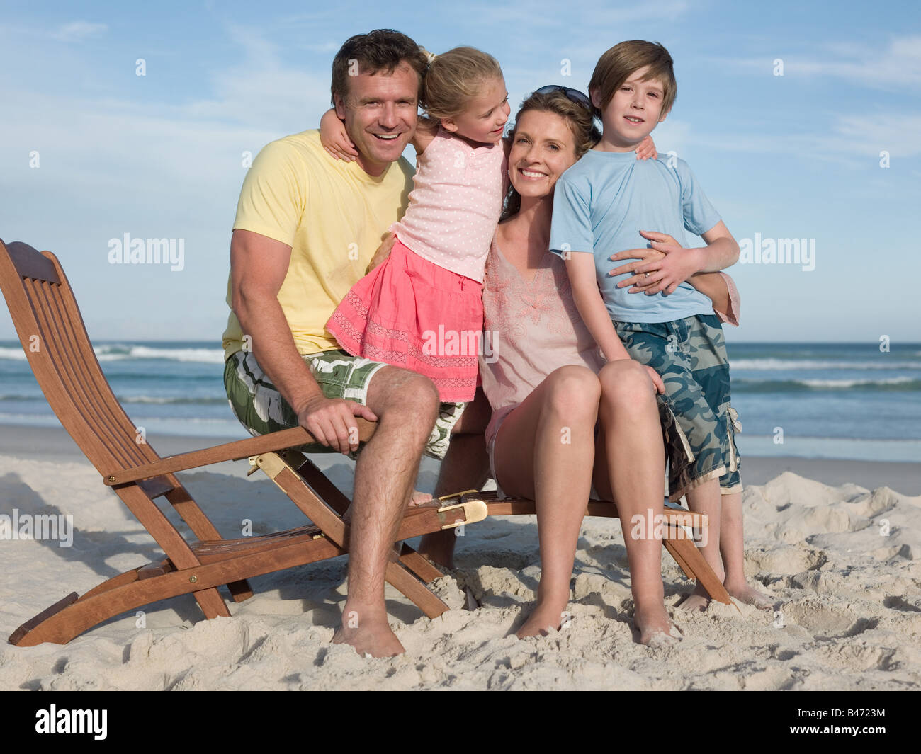 Family on a lounge chair Stock Photo