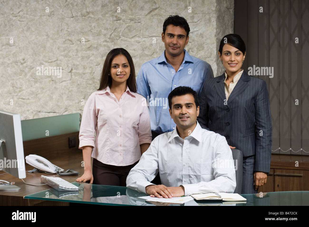 Four indian office colleagues Stock Photo - Alamy