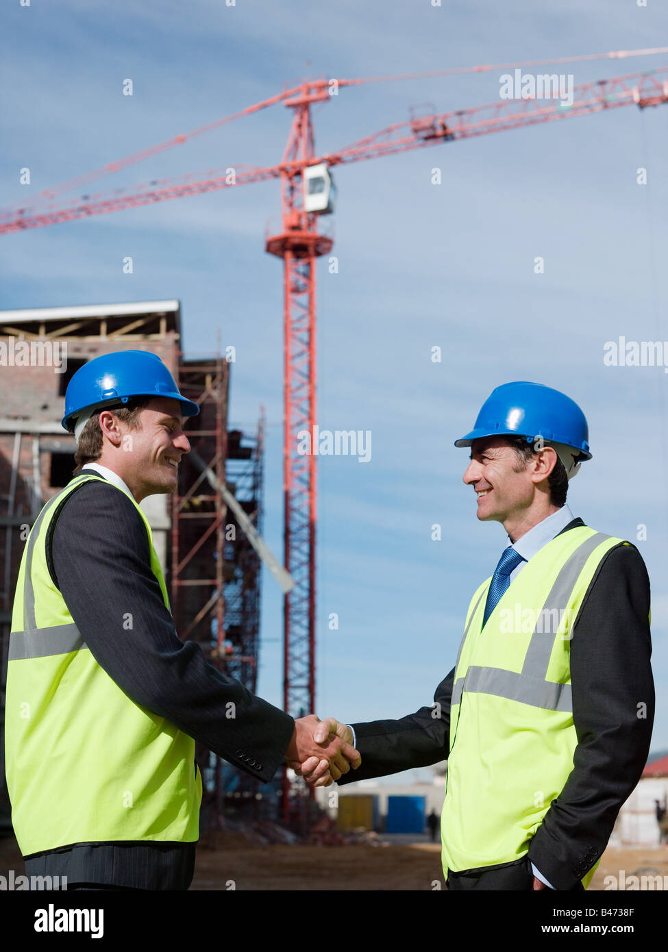 Engineers shaking hands Stock Photo Alamy