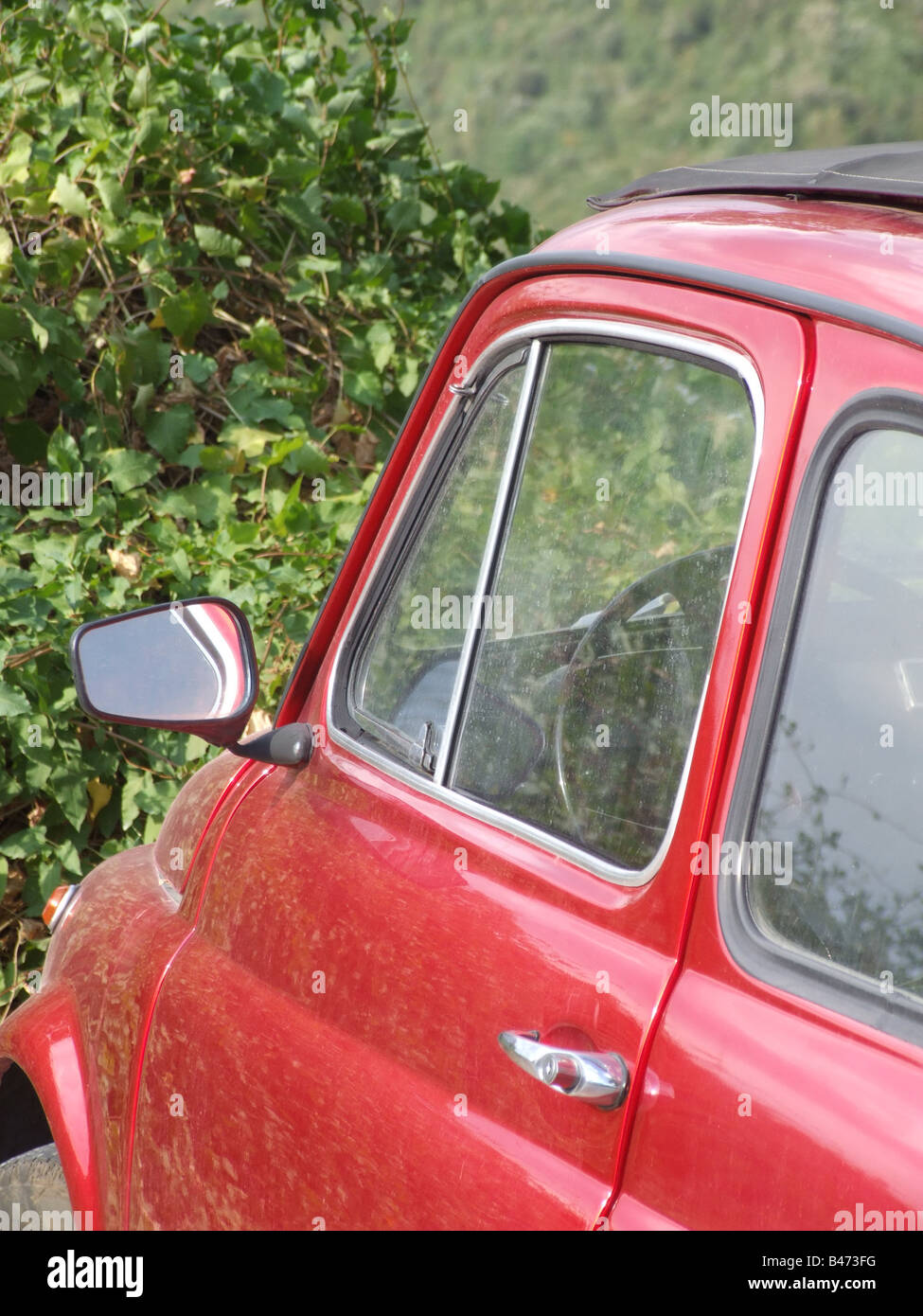 one old red fiat 500 car parked in countryside in italy Stock Photo - Alamy