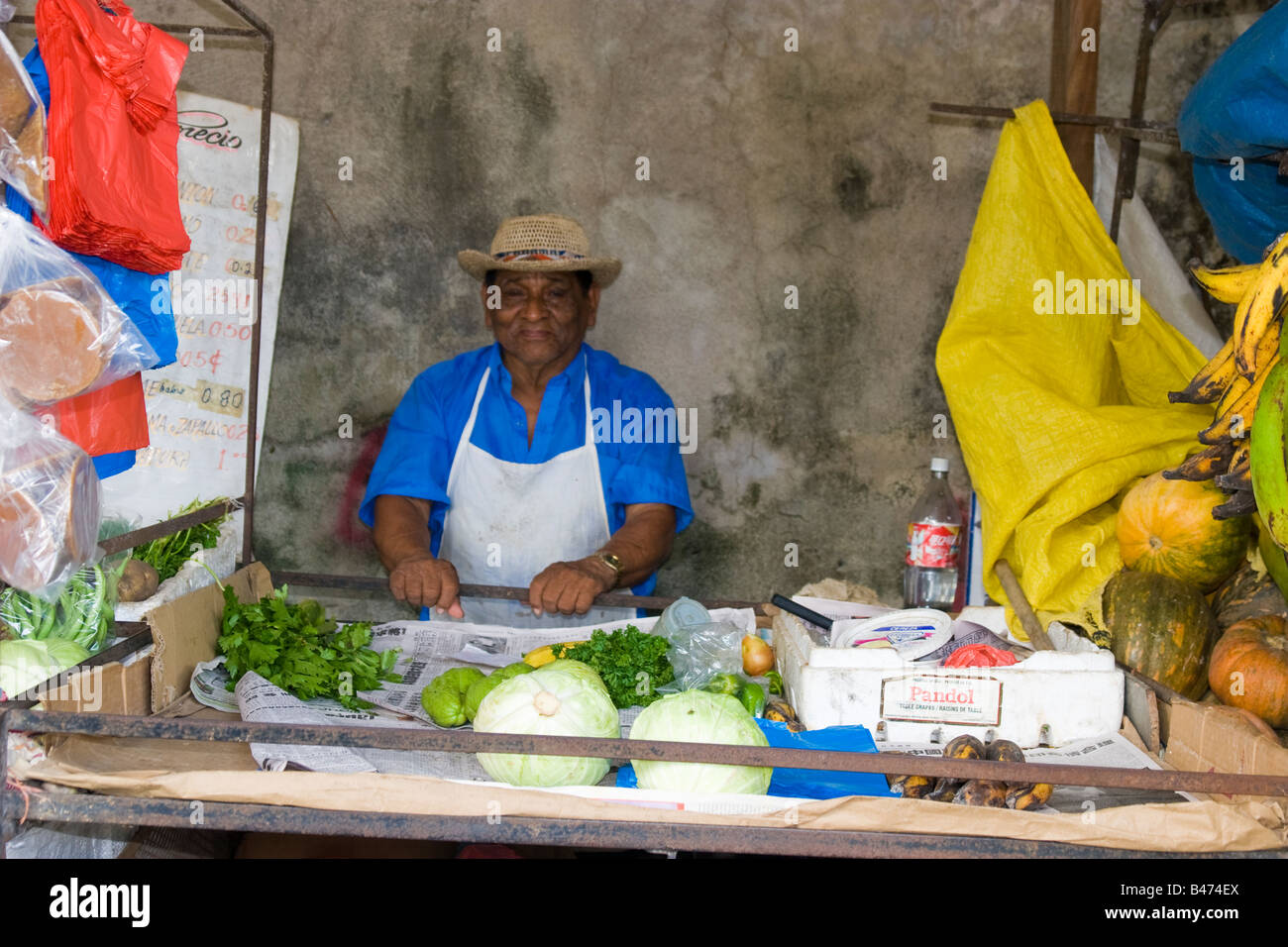 Man at his produce post Penonome Public Market, Province of Cocle, Republic of Panama, Central America Stock Photo