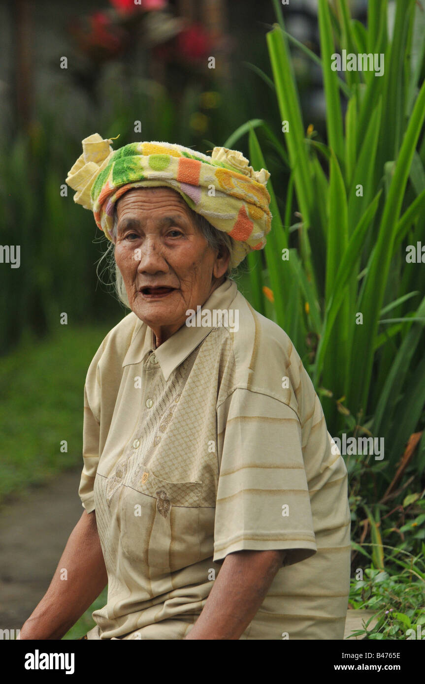 old Balinese Lady waiting for bus ubud , island of bali , indonesia Stock Photo
