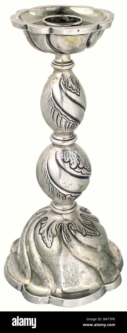 Hermann Göring, a silver candlestick in baroque style., Flaring bell-shaped base, the stem divided by three rings and decorated with foliage in relief work, large drip basin. On the viewing side the engraved personal arms of Göring. Silver hallmark '830' and master s mark. Height 35 cm. Weight 648 g. Hermann Göring owned a whole selection of these candlesticks, many of which were presented to him regularly on his birthdays, and then carry the corresponding date of 12 January. Provenance: 'Ehemaliger Besitz von Hermann Göring im Namen und für Rechnung des Freist, Stock Photo