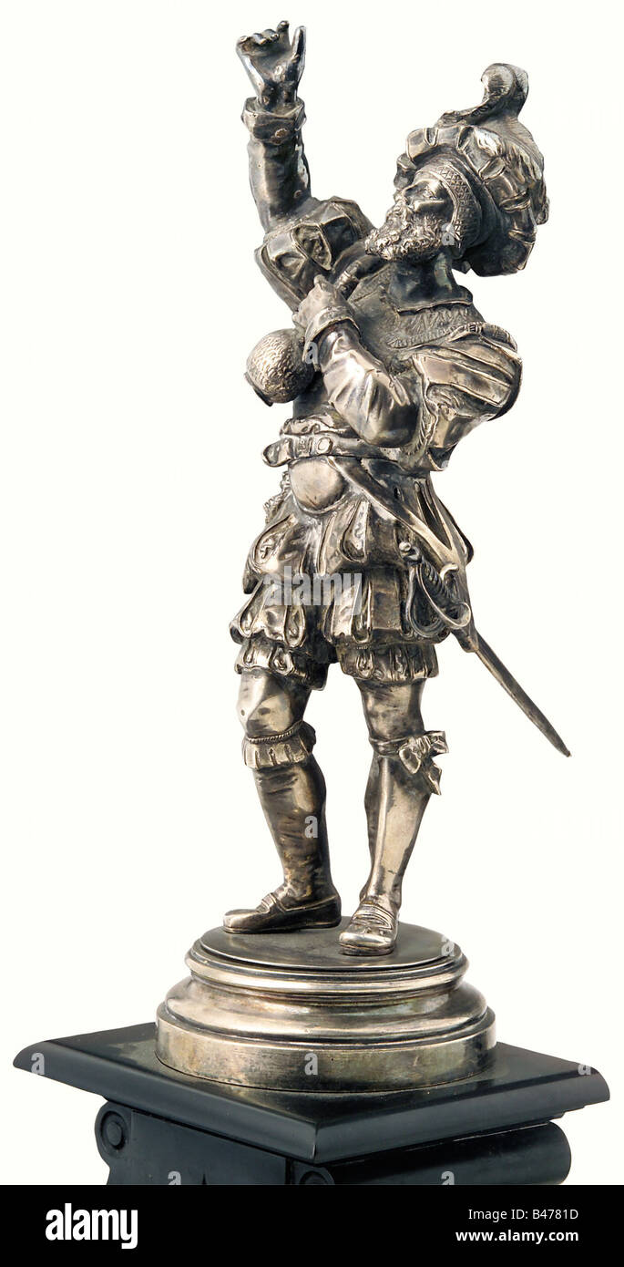 Kaiser Wilhelm II, 'The Drinking Landsknecht'. A Landsknecht in puffed clothes, with his right hand raised, and holding a wine bottle in his left. Silver plated bronze on a tall, stepped, black marble base, with a silver plated owner's plate on the front engraved with the crowned monogram 'W' under the imperial crown. There is a label pasted on the bottom 'Der Präsident der Schatull- und Vermögensverwaltung Seiner Majestät des Kaisers und Königs Wilhelm II' (Keeper of the Privy Purse of HM the Emperor and King Wilhelm II). Height 46 cm. An enchanting historism , Stock Photo