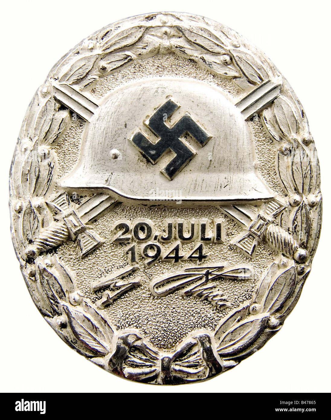 A Wound Badge '20 July 1944' in Silver., As new in the original presentation case. Massive silver, partially polished. Marked 'L/12' on the back for C.E. Juncker, Berlin along with the silver hallmark '800'. 44.43 x 37.22 mm. Weight 38.96 grams (OEK 3848). Original black presentation case, lined with black velvet and white silk, magnetic fittings, the catch is missing. Extremely rare, an original has never before been offered for sale. There have only been 23 awards at all three levels, gold, silver, and black. It is certain that two of these were awarded at th, Stock Photo
