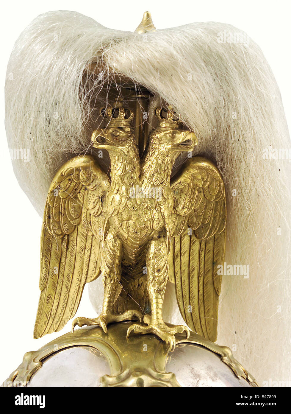 A regulation helmet for the k.u.k First Arcièren Life Guards, according to the 1905 standard for equipment and uniforms of the First Arcièren Life Guards. Fire-silver plated, nickel-silver skull, with the master's mark 'HS' on the nape. Armory stamps 'N20' and '40D'. The number '7' is stamped on the top. The bronze, crowned double eagle and the beautifully worked mountings which show some scratched marks and stamped numbers are fire gilded with abrasions in places. The metal chinscales are backed with black velvet. Champagne coloured silk lining, fine leather s, Stock Photo